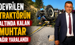 Devrilen traktörün altında kalan muhtar ağır yaralandı