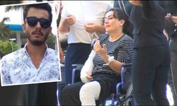 Yaralı anne, öldürülen  eşi ve oğlunu tekerlekli sandalyeyle uğurladı